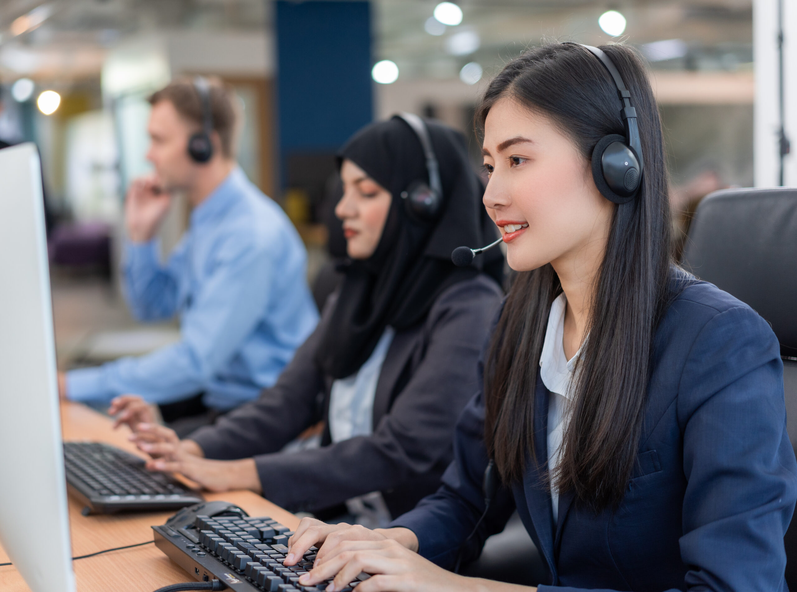 happy-smiling-operator-asian-woman-customer-service-agent-with-headsets-scaled.jpg